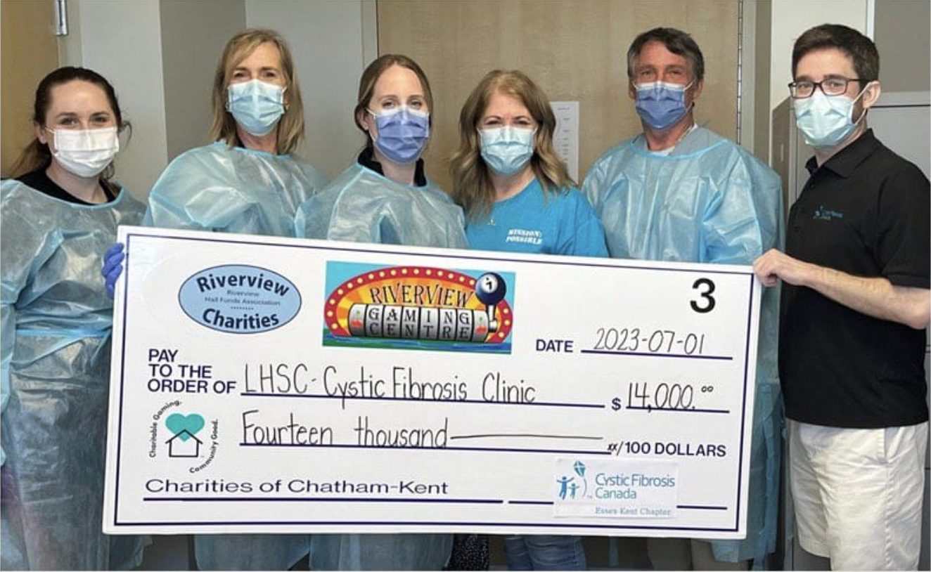 Our friends from LHSC holding their cheque with all the money that was raised through charitable gaming. 